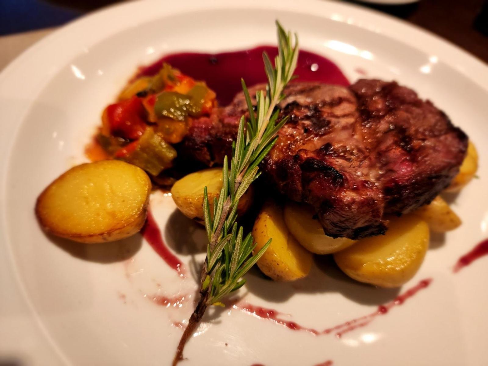 Regal Pacific Puerto Madero Hotell Buenos Aires Eksteriør bilde A steak prepared with a sprig of rosemary